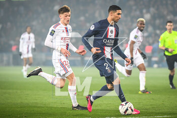 2023-04-02 - Johann LEPENANT of Lyon and Achraf HAKIMI of PSG during the French championship Ligue 1 football match between Paris Saint-Germain and Olympique Lyonnais (Lyon) on April 2, 2023 at Parc des Princes stadium in Paris, France - FOOTBALL - FRENCH CHAMP - PARIS SG V LYON - FRENCH LIGUE 1 - SOCCER