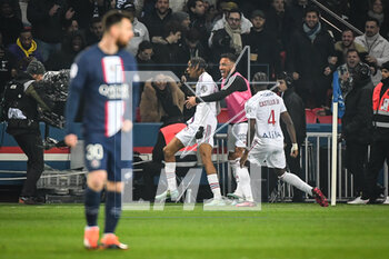2023-04-02 - Bradley BARCOLA of Lyon celebrate his goal with teammates and Lionel (Leo) MESSI of PSG looks dejected during the French championship Ligue 1 football match between Paris Saint-Germain and Olympique Lyonnais (Lyon) on April 2, 2023 at Parc des Princes stadium in Paris, France - FOOTBALL - FRENCH CHAMP - PARIS SG V LYON - FRENCH LIGUE 1 - SOCCER