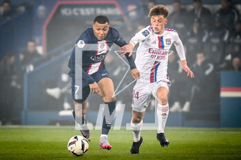 2023-04-02 - Kylian MBAPPE of PSG and Johann LEPENANT of Lyon during the French championship Ligue 1 football match between Paris Saint-Germain and Olympique Lyonnais (Lyon) on April 2, 2023 at Parc des Princes stadium in Paris, France - FOOTBALL - FRENCH CHAMP - PARIS SG V LYON - FRENCH LIGUE 1 - SOCCER