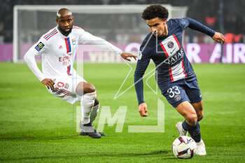 2023-04-02 - Moussa DEMBELE of Lyon and Warren ZAIRE-EMERY of PSG during the French championship Ligue 1 football match between Paris Saint-Germain and Olympique Lyonnais (Lyon) on April 2, 2023 at Parc des Princes stadium in Paris, France - FOOTBALL - FRENCH CHAMP - PARIS SG V LYON - FRENCH LIGUE 1 - SOCCER
