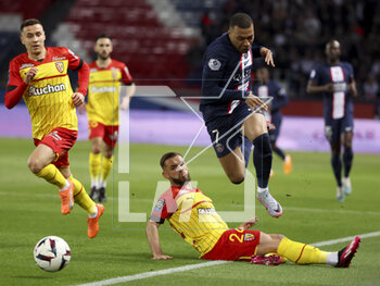 2023-04-15 - Kylian Mbappe of PSG, Jonathan Gradit of Lens, Przemyslaw Frankowski of Lens (left) during the French championship Ligue 1 football match between Paris Saint-Germain and RC Lens on April 15, 2023 at Parc des Princes stadium in Paris, France - FOOTBALL - FRENCH CHAMP - PARIS SG V LENS - FRENCH LIGUE 1 - SOCCER