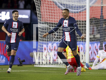 2023-04-15 - Kylian Mbappe, Carlos Soler (left) of PSG celebrate the goal of Lionel Messi of PSG during the French championship Ligue 1 football match between Paris Saint-Germain and RC Lens on April 15, 2023 at Parc des Princes stadium in Paris, France - FOOTBALL - FRENCH CHAMP - PARIS SG V LENS - FRENCH LIGUE 1 - SOCCER