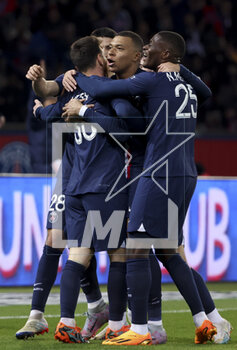2023-04-15 - Kylian Mbappe of PSG and teammates celebrate the goal of Lionel Messi #30 (left) during the French championship Ligue 1 football match between Paris Saint-Germain and RC Lens on April 15, 2023 at Parc des Princes stadium in Paris, France - FOOTBALL - FRENCH CHAMP - PARIS SG V LENS - FRENCH LIGUE 1 - SOCCER