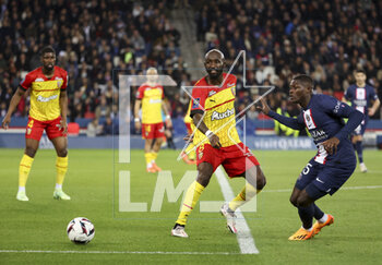 2023-04-15 - Seko Fofana of Lens, Nuno Mendes of PSG during the French championship Ligue 1 football match between Paris Saint-Germain (PSG) and RC Lens on April 15, 2023 at Parc des Princes stadium in Paris, France - FOOTBALL - FRENCH CHAMP - PARIS SG V LENS - FRENCH LIGUE 1 - SOCCER
