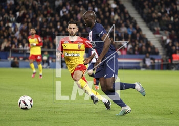 2023-04-15 - Danilo Pereira of PSG, Adrien Thomasson of Lens (left) during the French championship Ligue 1 football match between Paris Saint-Germain (PSG) and RC Lens on April 15, 2023 at Parc des Princes stadium in Paris, France - FOOTBALL - FRENCH CHAMP - PARIS SG V LENS - FRENCH LIGUE 1 - SOCCER