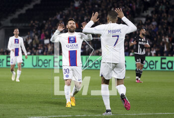 2023-04-21 - Kylian Mbappe of PSG celebrates his second goal with Lionel Messi (left) during the French championship Ligue 1 football match between SCO Angers and Paris Saint-Germain (PSG) on April 21, 2023 at Stade Raymond Kopa in Angers, France - FOOTBALL - FRENCH CHAMP - ANGERS V PARIS SG - FRENCH LIGUE 1 - SOCCER