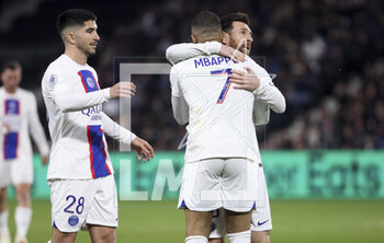 2023-04-21 - Kylian Mbappe of PSG celebrates his second goal with Lionel Messi, left Carlos Soler of PSG during the French championship Ligue 1 football match between SCO Angers and Paris Saint-Germain (PSG) on April 21, 2023 at Stade Raymond Kopa in Angers, France - FOOTBALL - FRENCH CHAMP - ANGERS V PARIS SG - FRENCH LIGUE 1 - SOCCER