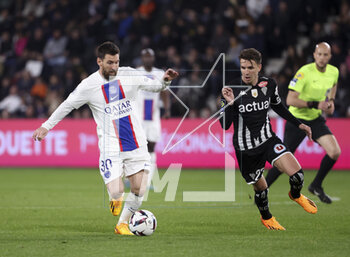 2023-04-21 - Lionel Messi of PSG, Adrien Hunou of Angers during the French championship Ligue 1 football match between SCO Angers and Paris Saint-Germain (PSG) on April 21, 2023 at Stade Raymond Kopa in Angers, France - FOOTBALL - FRENCH CHAMP - ANGERS V PARIS SG - FRENCH LIGUE 1 - SOCCER