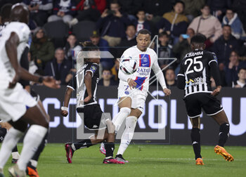 2023-04-21 - Kylian Mbappe of PSG, left Justin-Noel Kalumba Mwana-Ngongo of Angers during the French championship Ligue 1 football match between SCO Angers and Paris Saint-Germain (PSG) on April 21, 2023 at Stade Raymond Kopa in Angers, France - FOOTBALL - FRENCH CHAMP - ANGERS V PARIS SG - FRENCH LIGUE 1 - SOCCER