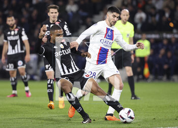 2023-04-21 - Cedric Hountondji of Angers, Carlos Soler of PSG during the French championship Ligue 1 football match between SCO Angers and Paris Saint-Germain (PSG) on April 21, 2023 at Stade Raymond Kopa in Angers, France - FOOTBALL - FRENCH CHAMP - ANGERS V PARIS SG - FRENCH LIGUE 1 - SOCCER