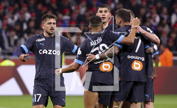 2023-04-23 - Cengiz Under of Marseille celebrates his goal with teammates during the French championship Ligue 1 football match between Olympique Lyonnais (Lyon) and Olympique de Marseille on April 23, 2023 at Groupama stadium in Decines-Charpieu near Lyon, France - FOOTBALL - FRENCH CHAMP - LYON V MARSEILLE - FRENCH LIGUE 1 - SOCCER