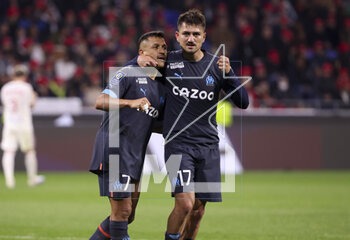 2023-04-23 - Cengiz Under of Marseille celebrates his goal with Alexis Sanchez (left) during the French championship Ligue 1 football match between Olympique Lyonnais (Lyon) and Olympique de Marseille on April 23, 2023 at Groupama stadium in Decines-Charpieu near Lyon, France - FOOTBALL - FRENCH CHAMP - LYON V MARSEILLE - FRENCH LIGUE 1 - SOCCER