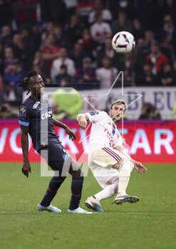 2023-04-23 - Issa Kabore of Marseille, Nicolas Tagliafico of Lyon during the French championship Ligue 1 football match between Olympique Lyonnais (Lyon) and Olympique de Marseille on April 23, 2023 at Groupama stadium in Decines-Charpieu near Lyon, France - FOOTBALL - FRENCH CHAMP - LYON V MARSEILLE - FRENCH LIGUE 1 - SOCCER