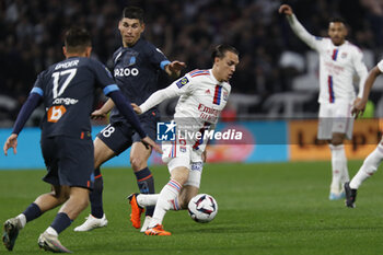 2023-04-23 - Maxence CAQUERET of Lyon and Ruslan MALINOVSKYI of Marseille during the French championship Ligue 1 football match between Olympique Lyonnais (Lyon) and Olympique de Marseille on April 23, 2023 at Groupama stadium in Decines-Charpieu near Lyon, France - FOOTBALL - FRENCH CHAMP - LYON V MARSEILLE - FRENCH LIGUE 1 - SOCCER