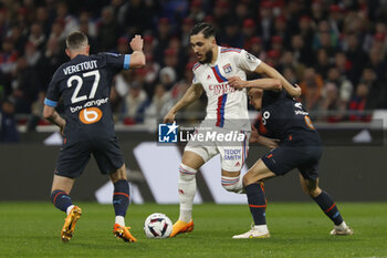 2023-04-23 - Rayan CHERKI of Lyon and Valentin RONGIER of Marseille and Jordan VERETOUT of Marseille during the French championship Ligue 1 football match between Olympique Lyonnais (Lyon) and Olympique de Marseille on April 23, 2023 at Groupama stadium in Decines-Charpieu near Lyon, France - FOOTBALL - FRENCH CHAMP - LYON V MARSEILLE - FRENCH LIGUE 1 - SOCCER
