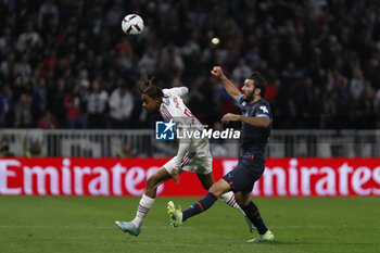 2023-04-23 - Bradley BARCOLA of Lyon and Sead KOLASINAC of Marseille during the French championship Ligue 1 football match between Olympique Lyonnais (Lyon) and Olympique de Marseille on April 23, 2023 at Groupama stadium in Decines-Charpieu near Lyon, France - FOOTBALL - FRENCH CHAMP - LYON V MARSEILLE - FRENCH LIGUE 1 - SOCCER