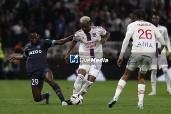 2023-04-23 - Thiago MENDES of Lyon and Issa KABORE of Marseille during the French championship Ligue 1 football match between Olympique Lyonnais (Lyon) and Olympique de Marseille on April 23, 2023 at Groupama stadium in Decines-Charpieu near Lyon, France - FOOTBALL - FRENCH CHAMP - LYON V MARSEILLE - FRENCH LIGUE 1 - SOCCER
