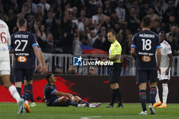 2023-04-23 - Referee Jerome BRISARD and Alexis SANCHEZ of Marseille during the French championship Ligue 1 football match between Olympique Lyonnais (Lyon) and Olympique de Marseille on April 23, 2023 at Groupama stadium in Decines-Charpieu near Lyon, France - FOOTBALL - FRENCH CHAMP - LYON V MARSEILLE - FRENCH LIGUE 1 - SOCCER