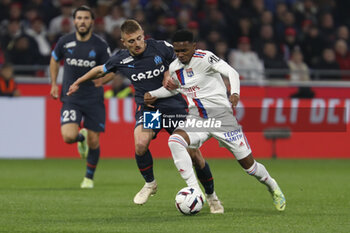 2023-04-23 - JEFFINHO of Lyon and Valentin RONGIER of Marseille during the French championship Ligue 1 football match between Olympique Lyonnais (Lyon) and Olympique de Marseille on April 23, 2023 at Groupama stadium in Decines-Charpieu near Lyon, France - FOOTBALL - FRENCH CHAMP - LYON V MARSEILLE - FRENCH LIGUE 1 - SOCCER