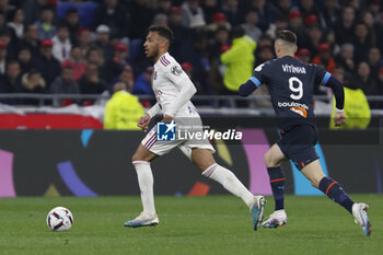 2023-04-23 - Corentin TOLISSO of Lyon and VITINHA of Marseille during the French championship Ligue 1 football match between Olympique Lyonnais (Lyon) and Olympique de Marseille on April 23, 2023 at Groupama stadium in Decines-Charpieu near Lyon, France - FOOTBALL - FRENCH CHAMP - LYON V MARSEILLE - FRENCH LIGUE 1 - SOCCER