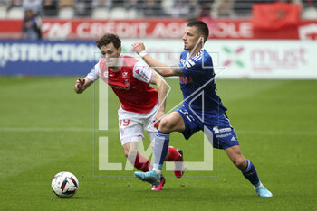 2023-04-23 - Frederic Guilbert of Strasbourg, left Mitchell Van Bergen of Reims during the French championship Ligue 1 football match between Stade de Reims and RC Strasbourg on April 23, 2023 at Stade Auguste Delaune in Reims, France - FOOTBALL - FRENCH CHAMP - REIMS V STRASBOURG - FRENCH LIGUE 1 - SOCCER