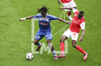 2023-04-23 - Ismael Doukoure of Strasbourg, Dion Lopy of Reims during the French championship Ligue 1 football match between Stade de Reims and RC Strasbourg on April 23, 2023 at Stade Auguste Delaune in Reims, France - FOOTBALL - FRENCH CHAMP - REIMS V STRASBOURG - FRENCH LIGUE 1 - SOCCER