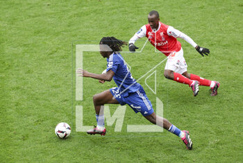 2023-04-23 - Ismael Doukoure of Strasbourg, Kamory Doumbia of Reims during the French championship Ligue 1 football match between Stade de Reims and RC Strasbourg on April 23, 2023 at Stade Auguste Delaune in Reims, France - FOOTBALL - FRENCH CHAMP - REIMS V STRASBOURG - FRENCH LIGUE 1 - SOCCER