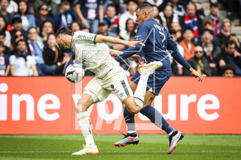2023-04-30 - Montassar TALBI of Lorient and Kylian MBAPPE of PSG during the French championship Ligue 1 football match between Paris Saint-Germain and FC Lorient on April 30, 2023 at Parc des Princes stadium in Paris, France - FOOTBALL - FRENCH CHAMP - PARIS SG V LORIENT - FRENCH LIGUE 1 - SOCCER