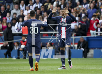 2023-04-30 - Kylian Mbappe of PSG celebrates his goal with Lionel Messi (left) during the French championship Ligue 1 football match between Paris Saint-Germain and FC Lorient on April 30, 2023 at Parc des Princes stadium in Paris, France - FOOTBALL - FRENCH CHAMP - PARIS SG V LORIENT - FRENCH LIGUE 1 - SOCCER