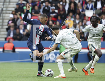 2023-04-30 - Kylian Mbappe of PSG, Montassar Talbi, Bamo Meite of Lorient during the French championship Ligue 1 football match between Paris Saint-Germain and FC Lorient on April 30, 2023 at Parc des Princes stadium in Paris, France - FOOTBALL - FRENCH CHAMP - PARIS SG V LORIENT - FRENCH LIGUE 1 - SOCCER