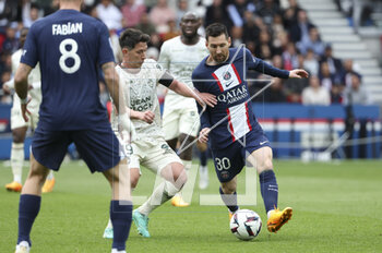 2023-04-30 - Lionel Messi of PSG, left Laurent Abergel of Lorient during the French championship Ligue 1 football match between Paris Saint-Germain and FC Lorient on April 30, 2023 at Parc des Princes stadium in Paris, France - FOOTBALL - FRENCH CHAMP - PARIS SG V LORIENT - FRENCH LIGUE 1 - SOCCER