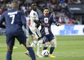2023-04-30 - Lionel Messi of PSG, left Bamba Dieng of Lorient during the French championship Ligue 1 football match between Paris Saint-Germain and FC Lorient on April 30, 2023 at Parc des Princes stadium in Paris, France - FOOTBALL - FRENCH CHAMP - PARIS SG V LORIENT - FRENCH LIGUE 1 - SOCCER