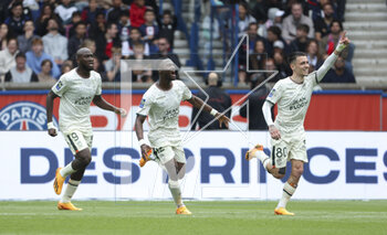 2023-04-30 - Romain Faivre of Lorient #80 (right) celebrates his goal with Ibrahima Kone, Darlin Yongwa during the French championship Ligue 1 football match between Paris Saint-Germain and FC Lorient on April 30, 2023 at Parc des Princes stadium in Paris, France - FOOTBALL - FRENCH CHAMP - PARIS SG V LORIENT - FRENCH LIGUE 1 - SOCCER