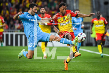 2023-05-06 - Sead KOLASINAC of Marseille and Lois OPENDA of Lens during the French championship Ligue 1 football match between RC Lens and Olympique de Marseille on May 6, 2023 at Bollaert-Delelis stadium in Lens, France - FOOTBALL - FRENCH CHAMP - LENS V MARSEILLE - FRENCH LIGUE 1 - SOCCER
