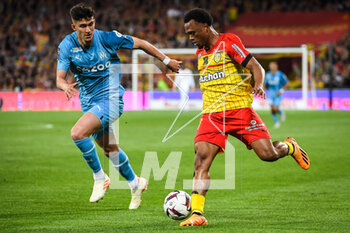 2023-05-06 - Leonardo BALERDI of Marseille and Lois OPENDA of Lens during the French championship Ligue 1 football match between RC Lens and Olympique de Marseille on May 6, 2023 at Bollaert-Delelis stadium in Lens, France - FOOTBALL - FRENCH CHAMP - LENS V MARSEILLE - FRENCH LIGUE 1 - SOCCER