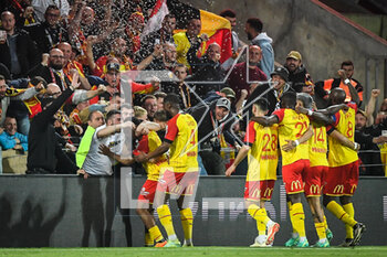 2023-05-06 - Lois OPENDA of Lens celebrate his goal with teammates and supporters during the French championship Ligue 1 football match between RC Lens and Olympique de Marseille on May 6, 2023 at Bollaert-Delelis stadium in Lens, France - FOOTBALL - FRENCH CHAMP - LENS V MARSEILLE - FRENCH LIGUE 1 - SOCCER