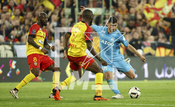 2023-05-06 - Ruslan Malinovskyi of Marseille, left Seko Fofana of Lens during the French championship Ligue 1 football match between RC Lens (RCL) and Olympique de Marseille (OM) on May 6, 2023 at Stade Bollaert-Delelis in Lens, France - FOOTBALL - FRENCH CHAMP - LENS V MARSEILLE - FRENCH LIGUE 1 - SOCCER