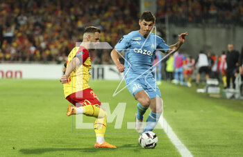 2023-05-06 - Jonathan Gradit of Lens, Ruslan Malinovskyi of Marseille during the French championship Ligue 1 football match between RC Lens (RCL) and Olympique de Marseille (OM) on May 6, 2023 at Stade Bollaert-Delelis in Lens, France - FOOTBALL - FRENCH CHAMP - LENS V MARSEILLE - FRENCH LIGUE 1 - SOCCER