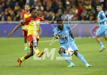 2023-05-06 - Chancel Mbemba of Marseille, left Lois Openda of Lens during the French championship Ligue 1 football match between RC Lens (RCL) and Olympique de Marseille (OM) on May 6, 2023 at Stade Bollaert-Delelis in Lens, France - FOOTBALL - FRENCH CHAMP - LENS V MARSEILLE - FRENCH LIGUE 1 - SOCCER