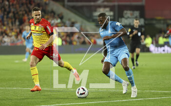 2023-05-06 - Nuno Tavares of Marseille, left Przemyslaw Frankowski of Lens during the French championship Ligue 1 football match between RC Lens (RCL) and Olympique de Marseille (OM) on May 6, 2023 at Stade Bollaert-Delelis in Lens, France - FOOTBALL - FRENCH CHAMP - LENS V MARSEILLE - FRENCH LIGUE 1 - SOCCER