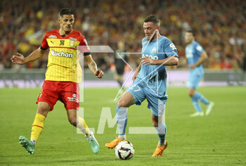 2023-05-06 - Jordan Veretout of Marseille, left Florian Sotoca of Lens during the French championship Ligue 1 football match between RC Lens (RCL) and Olympique de Marseille (OM) on May 6, 2023 at Stade Bollaert-Delelis in Lens, France - FOOTBALL - FRENCH CHAMP - LENS V MARSEILLE - FRENCH LIGUE 1 - SOCCER
