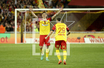 2023-05-06 - Florian Sotoca, Przemyslaw Frankowski of Lens celebrate the victory following the French championship Ligue 1 football match between RC Lens (RCL) and Olympique de Marseille (OM) on May 6, 2023 at Stade Bollaert-Delelis in Lens, France - FOOTBALL - FRENCH CHAMP - LENS V MARSEILLE - FRENCH LIGUE 1 - SOCCER