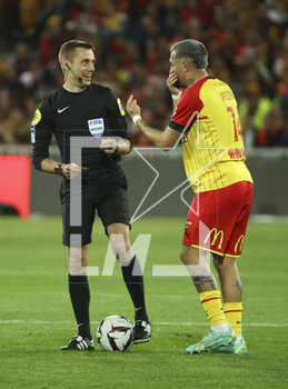2023-05-06 - Referee Clement Turpin with Facundo Medina of Lens during the French championship Ligue 1 football match between RC Lens (RCL) and Olympique de Marseille (OM) on May 6, 2023 at Stade Bollaert-Delelis in Lens, France - FOOTBALL - FRENCH CHAMP - LENS V MARSEILLE - FRENCH LIGUE 1 - SOCCER