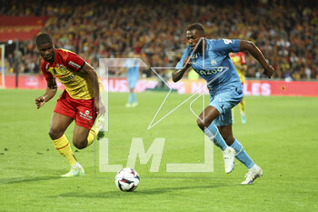 2023-05-06 - Nuno Tavares of Marseille, left Kevin Danso of Lens during the French championship Ligue 1 football match between RC Lens (RCL) and Olympique de Marseille (OM) on May 6, 2023 at Stade Bollaert-Delelis in Lens, France - FOOTBALL - FRENCH CHAMP - LENS V MARSEILLE - FRENCH LIGUE 1 - SOCCER