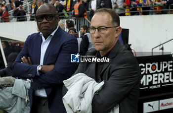 2023-05-06 - OM ambassadors Basile Boli and Jean-Pierre Papin attend the French championship Ligue 1 football match between RC Lens (RCL) and Olympique de Marseille (OM) on May 6, 2023 at Stade Bollaert-Delelis in Lens, France - FOOTBALL - FRENCH CHAMP - LENS V MARSEILLE - FRENCH LIGUE 1 - SOCCER