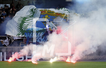 2023-05-07 - Flares on the pitch thrown by supporters of Troyes during the French championship Ligue 1 football match between Estac Troyes and Paris Saint-Germain on May 7, 2023 at l'Aube stadium in Troyes, France - FOOTBALL - FRENCH CHAMP - TROYES V PARIS SG - FRENCH LIGUE 1 - SOCCER