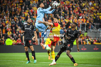2023-05-12 - Yunis ABDELHAMID of Reims, Yehvann DIOUF of Reims, Adrien THOMASSON of Lens and Emmanuel AGBADOU of Reims during the French championship Ligue 1 football match between RC Lens and Stade de Reims on May 12, 2023 at Bollaert-Delelis stadium in Lens, France - FOOTBALL - FRENCH CHAMP - LENS V REIMS - FRENCH LIGUE 1 - SOCCER