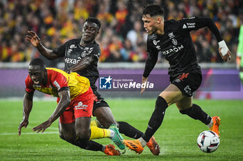2023-05-12 - Deiver MACHADO of Lens, Azor MATUSIWA of Reims and Maxime BUSI of Reims during the French championship Ligue 1 football match between RC Lens and Stade de Reims on May 12, 2023 at Bollaert-Delelis stadium in Lens, France - FOOTBALL - FRENCH CHAMP - LENS V REIMS - FRENCH LIGUE 1 - SOCCER