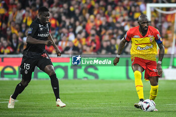 2023-05-12 - Marshall MUNETSI of Reims and Seko FOFANA of Lens during the French championship Ligue 1 football match between RC Lens and Stade de Reims on May 12, 2023 at Bollaert-Delelis stadium in Lens, France - FOOTBALL - FRENCH CHAMP - LENS V REIMS - FRENCH LIGUE 1 - SOCCER