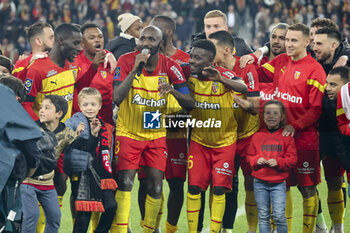 2023-05-12 - Captain Seko Fofana of Lens holding the mic, Salis Abdul Samed and teammates celebrate the victory following the French championship Ligue 1 football match between RC Lens and Stade de Reims on May 12, 2023 at Stade Bollaert-Delelis in Lens, France - FOOTBALL - FRENCH CHAMP - LENS V REIMS - FRENCH LIGUE 1 - SOCCER